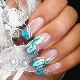 Caractéristiques de la veste turquoise design sur les ongles